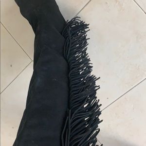Knee high fringe boots